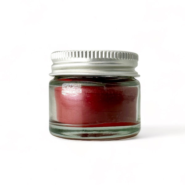 Poppy red tinted creamy and conditioning lip balm enriched with raw honey and beeswax - hydrating formula for dry, mature lips affected by hormonal changes.