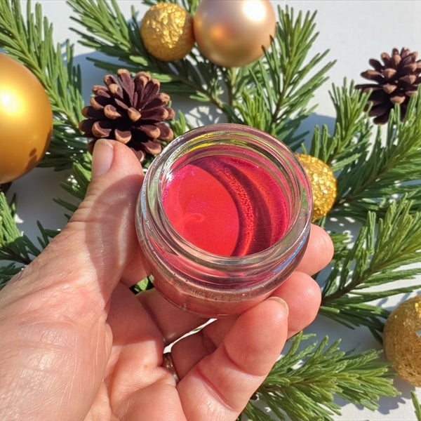 Poppy red tinted creamy and conditioning lip balm enriched with raw honey and beeswax - hydrating formula for dry, mature lips affected by hormonal changes.