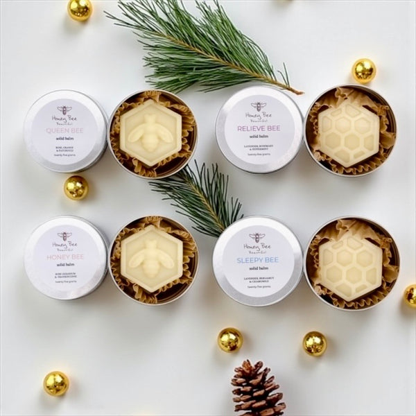 Collection of rich raw honey and beeswax balms in handy aluminium tins multipurpose moisturisers for very dry or sensitive menopausal skin, soothing and protective with natural ingredients.