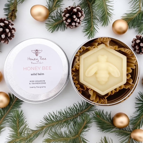 A rich raw honey and beeswax balm in a handy aluminium tin with rose geranium and frankincense as a multipurpose moisturiser for very dry or sensitive menopausal skin, soothing and protective with natural ingredients.
