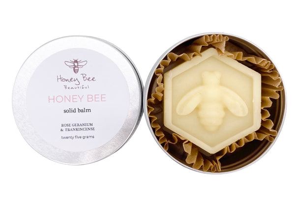 A rich raw honey and beeswax balm in a handy aluminium tin with rose geranium and frankincense as a multipurpose moisturiser for very dry or sensitive menopausal skin, soothing and protective with natural ingredients.