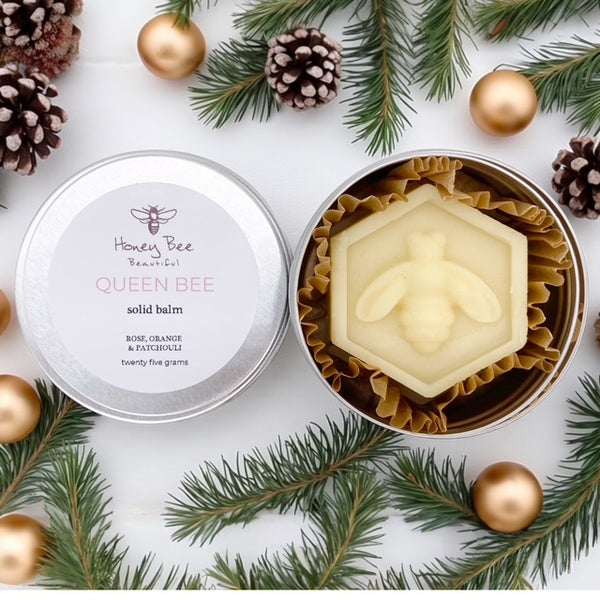 A rich raw honey and beeswax balm in a handy aluminium tin with rose, orange and patchouli as a multipurpose moisturiser for very dry or sensitive menopausal skin, soothing and protective with natural ingredients.