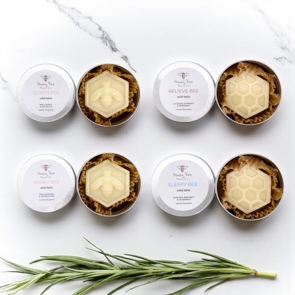 Collection of rich raw honey and beeswax balms in handy aluminium tins - multipurpose moisturisers for very dry or sensitive menopausal skin, soothing and protective with natural ingredients.