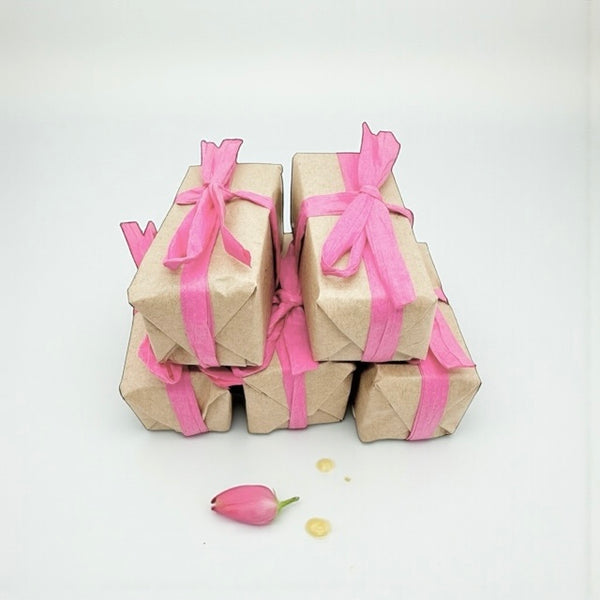 Mini stack of gentle raw honey soap with rose, orange and patchouli, enriched with beeswax and plant oils, nourishing and soothing for dry, sensitive, or mature skin, with a subtle floral-citrus-woody fragrance.